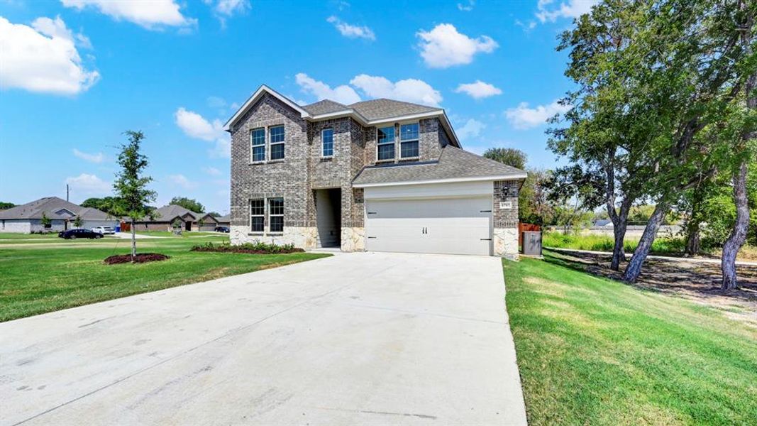Front exterior of a new home in Bluff Springs, Ferris, TX, highlighting curb appeal (Image 2). Front exterior of a new home in Bluff Springs, Ferris, TX, highlighting curb appeal (Image 2).