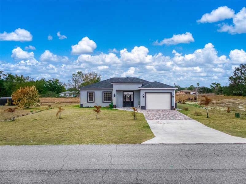 Front exterior of a new home in , Avon Park, FL, highlighting curb appeal (Image 26).