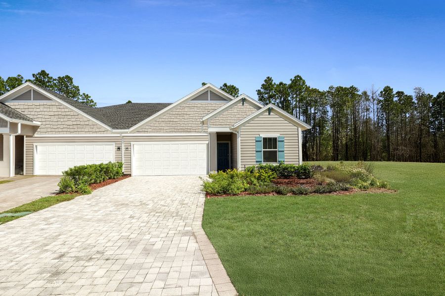 Front exterior of a new home in Silver Meadows at SilverLeaf: Silver Meadows Villas, St. Augustine, FL, highlighting curb appeal (Image 1).