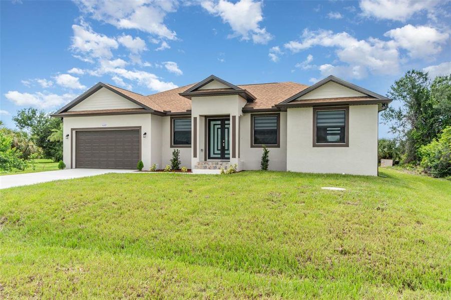 Front exterior of a new home in , Port Charlotte, FL, highlighting curb appeal (Image 19). Front exterior of a new home in , Port Charlotte, FL, highlighting curb appeal (Image 19).