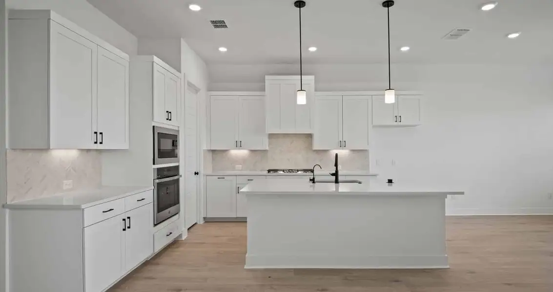 Representative furnished interior of a home built from the Farris by Chesmar Homes in 6 Creeks, Kyle (Image 3).
