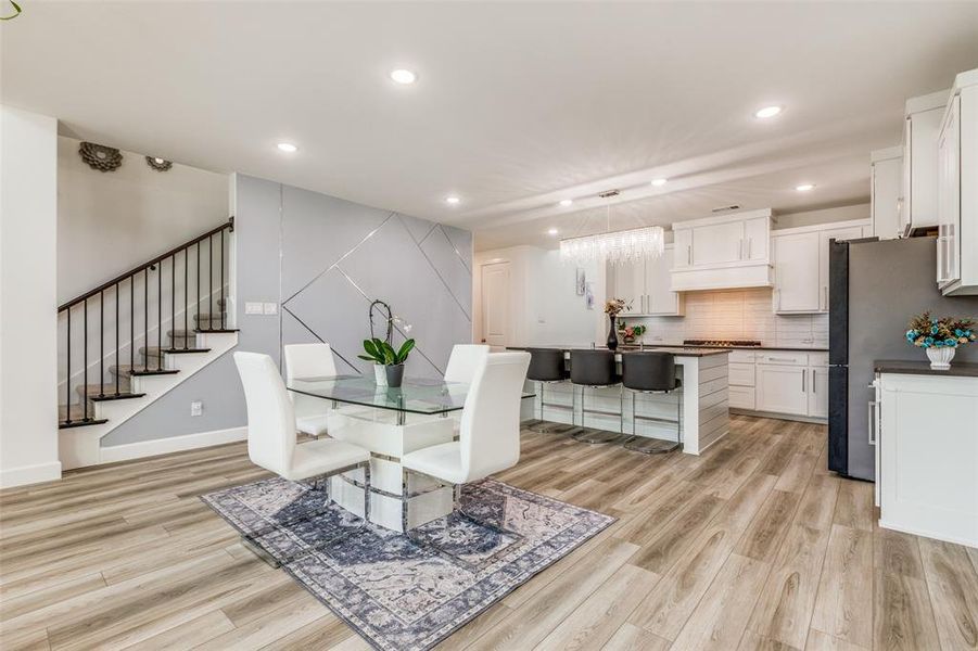 Spacious dining room featuring a beautiful accent wall—perfect for hosting memorable family dinners, and holiday celebrations. This versatile space adapts effortlessly to both entertaining and everyday living! Spacious dining room featuring a beautiful accent wall—perfect for hosting memorable family dinners, and holiday celebrations. This versatile space adapts effortlessly to both entertaining and everyday living!