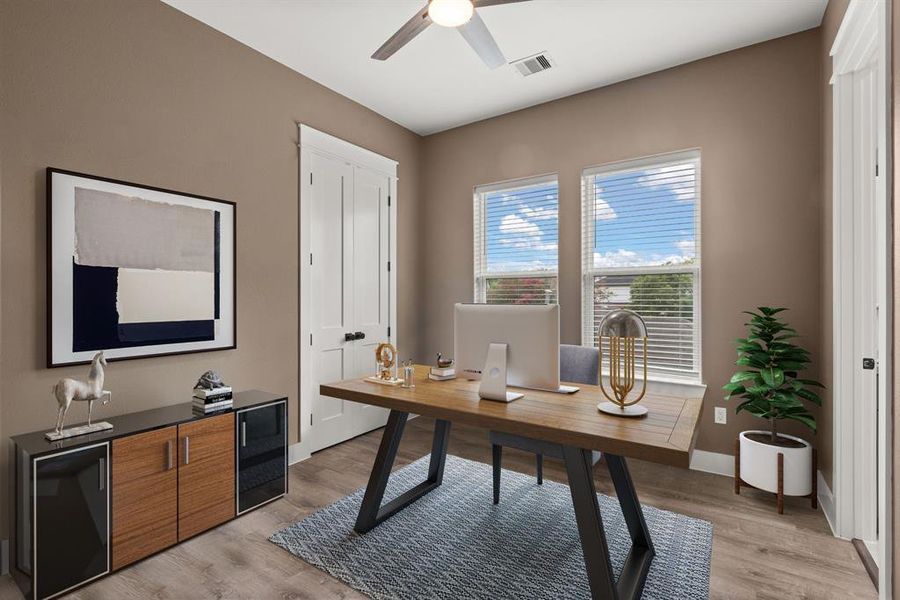 The bedroom features a ceiling fan, two windows for natural light, and convenient access to a shared bathroom, offering comfort and functionality.