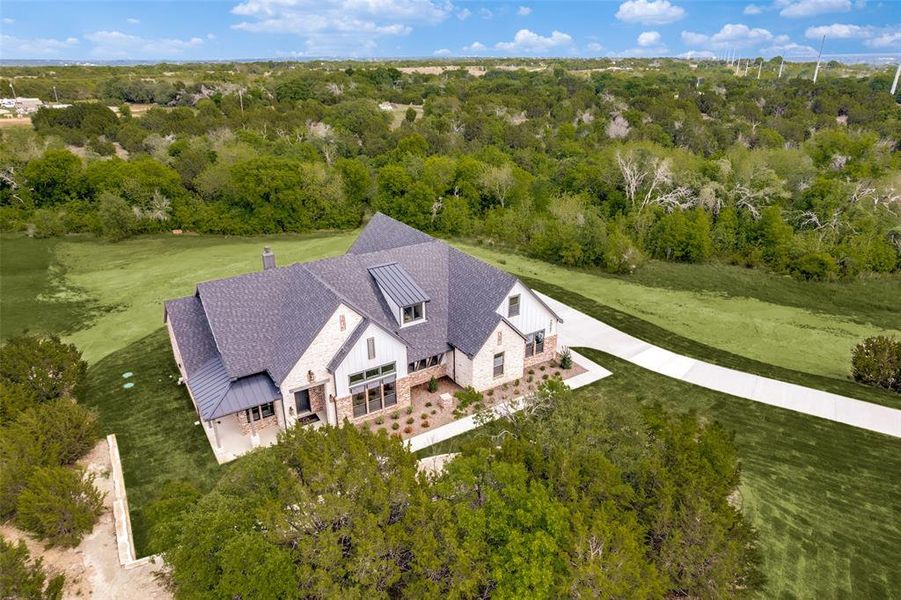 Front exterior of a new home in , Weatherford, TX, highlighting curb appeal (Image 24).