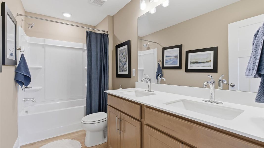 Vibrant and welcoming bathroom with elegant countertop space and polished details located at Pelham Crossing