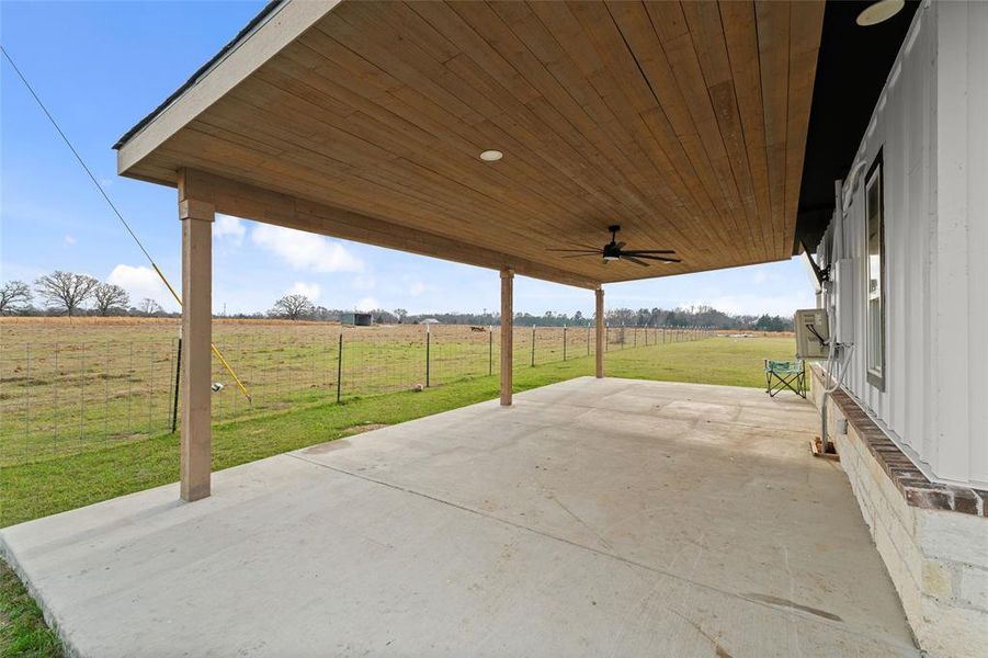 Spacious concrete patio featuring a wood-finish ceiling, recessed lighting, and a ceiling fan Spacious concrete patio featuring a wood-finish ceiling, recessed lighting, and a ceiling fan