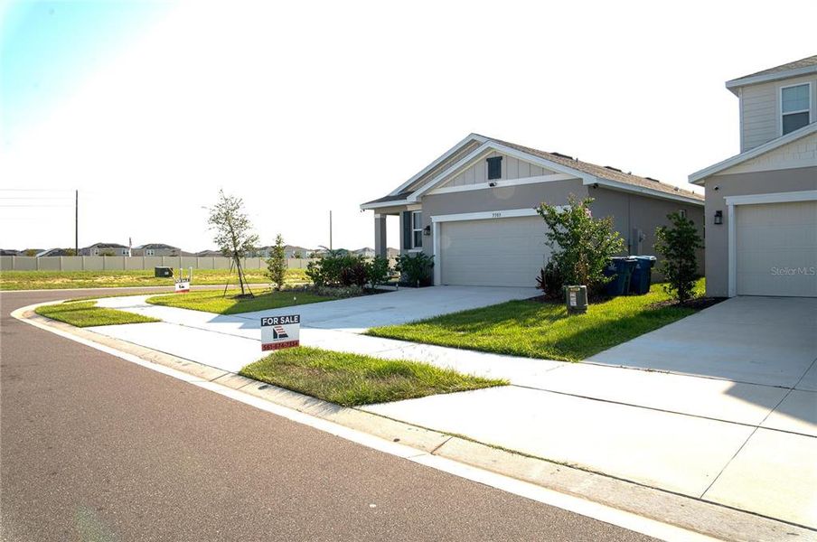 Front exterior of a new home in , Haines City, FL, highlighting curb appeal (Image 22).