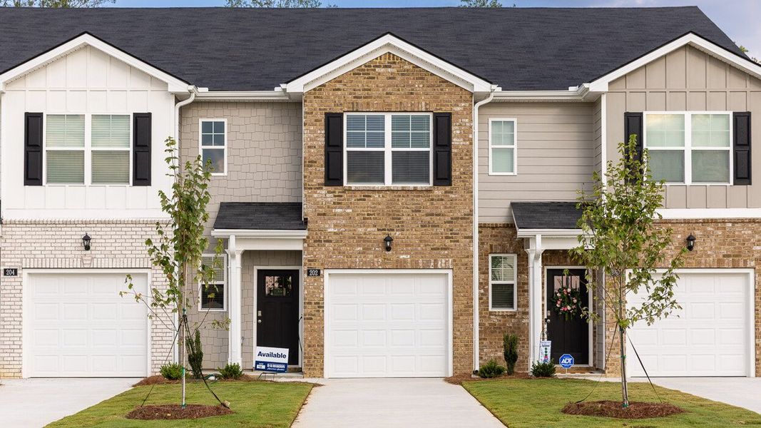 Front exterior of a new home in Young's Crossing, Stone Mountain, GA, highlighting curb appeal (Image 1). Front exterior of a new home in Young's Crossing, Stone Mountain, GA, highlighting curb appeal (Image 1).