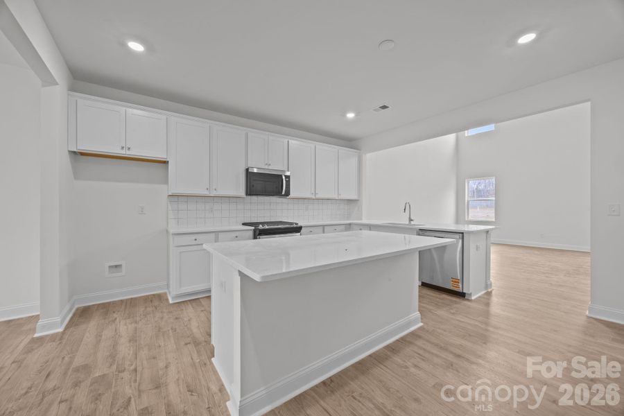 kitchen is open to dining area & family room