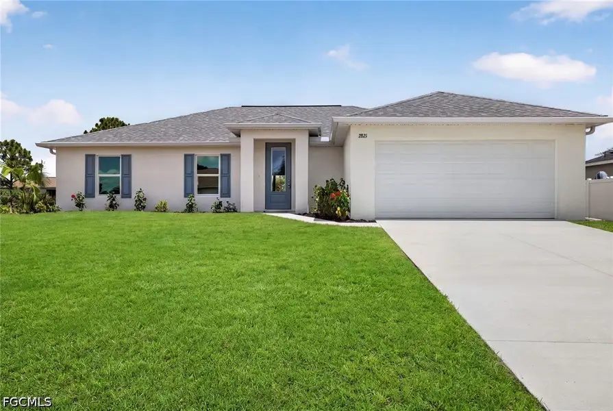 Front exterior of a new home in Cape Coral, Cape Coral, FL, highlighting curb appeal (Image 1). Front exterior of a new home in Cape Coral, Cape Coral, FL, highlighting curb appeal (Image 1).