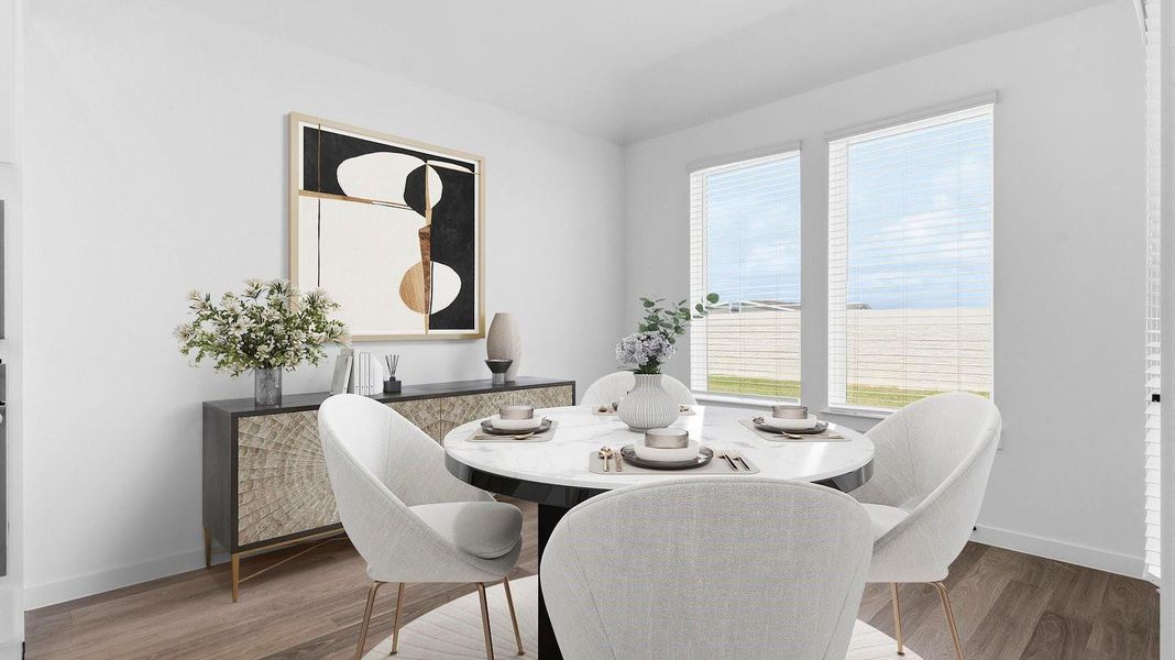 Spacious open concept dining area with vinyl wood flooring and access to the living and kitchen areas Spacious open concept dining area with vinyl wood flooring and access to the living and kitchen areas