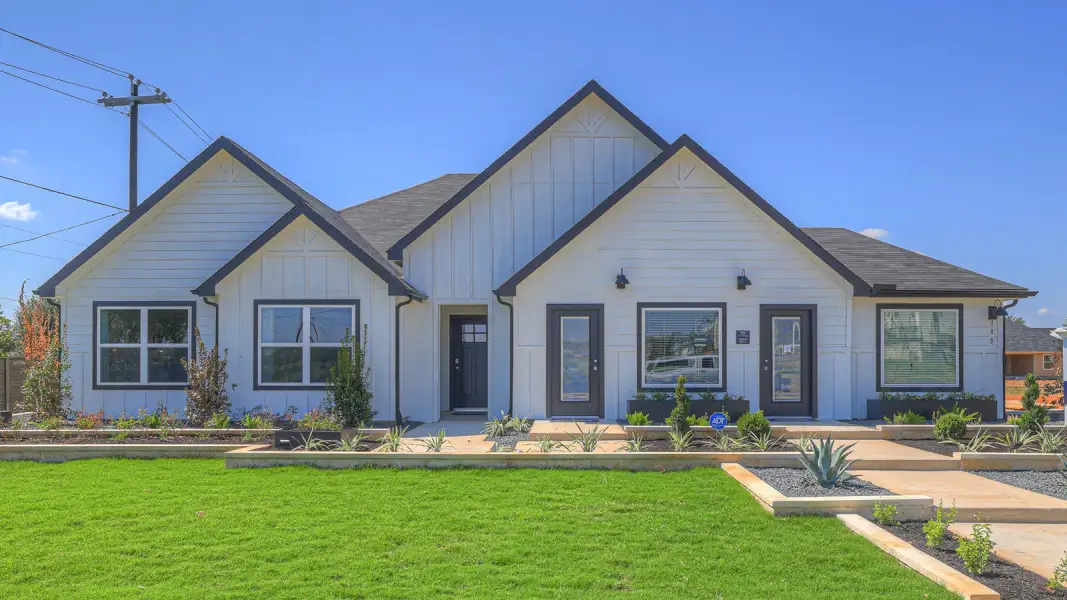 Front exterior of a new home in Sonoma Oaks, Fredericksburg, TX, highlighting curb appeal (Image 1). Front exterior of a new home in Sonoma Oaks, Fredericksburg, TX, highlighting curb appeal (Image 1).