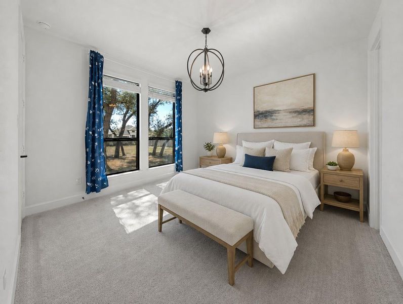 A well-lit bedroom features ample natural light and a stylish overhead chandelier. A well-lit bedroom features ample natural light and a stylish overhead chandelier.