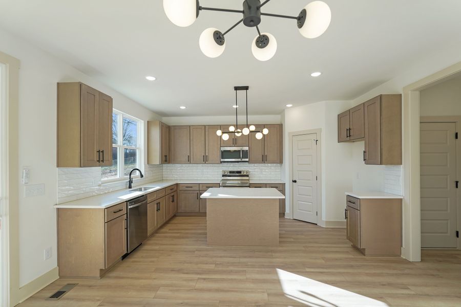 Representative furnished interior of a home built from the Two Story Farmhouse by Norfleet Builders in Cambria, White House (Image 7).