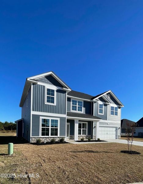 Front exterior of a new home in Athens Acres, New Bern, NC, highlighting curb appeal (Image 2). Front exterior of a new home in Athens Acres, New Bern, NC, highlighting curb appeal (Image 2).