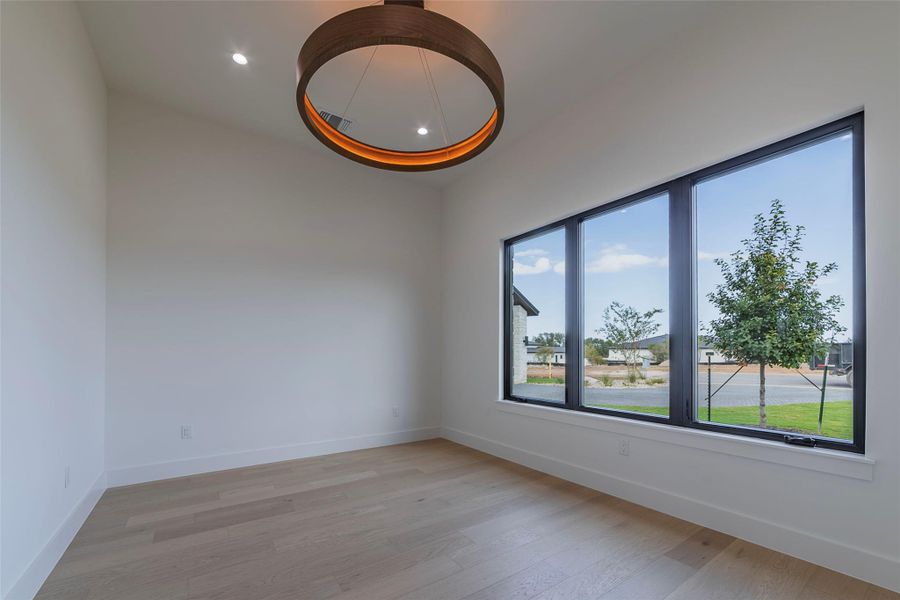 Unfurnished room featuring light wood-type flooring and recessed lighting