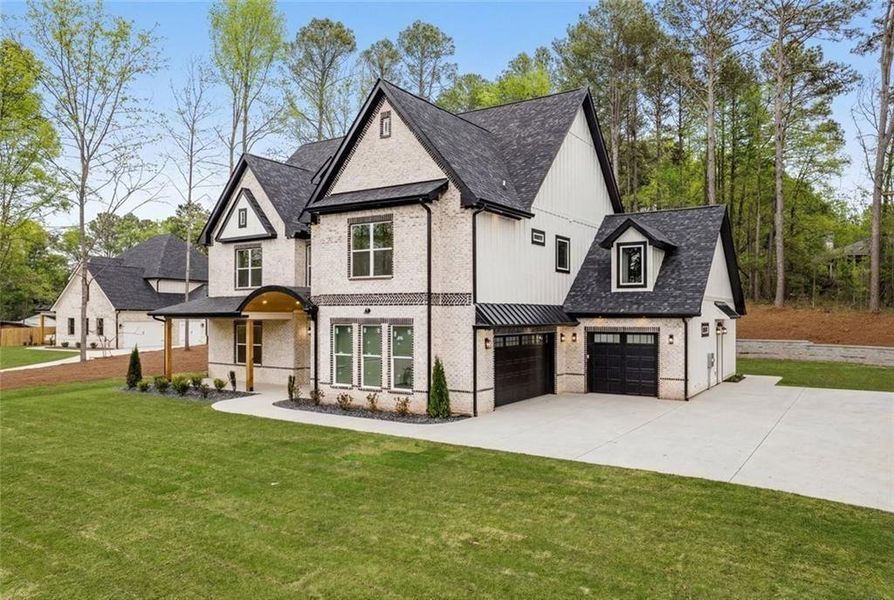 Front exterior of a new home in , Winder, GA, highlighting curb appeal (Image 31).