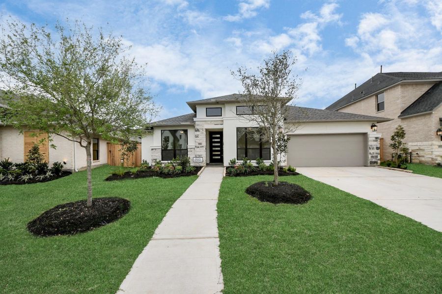 Front exterior of a new home in Candela South, Richmond, TX, highlighting curb appeal (Image 20).