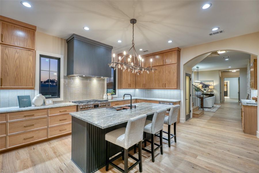 Exquisite island kitchen with Fishel & Paykel appliance package.