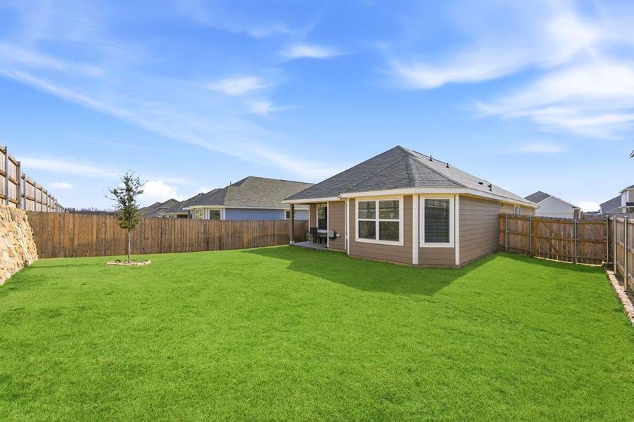 Exterior details and patio area of a home in Retreat at Fossil Creek, Fort Worth (Image 27).