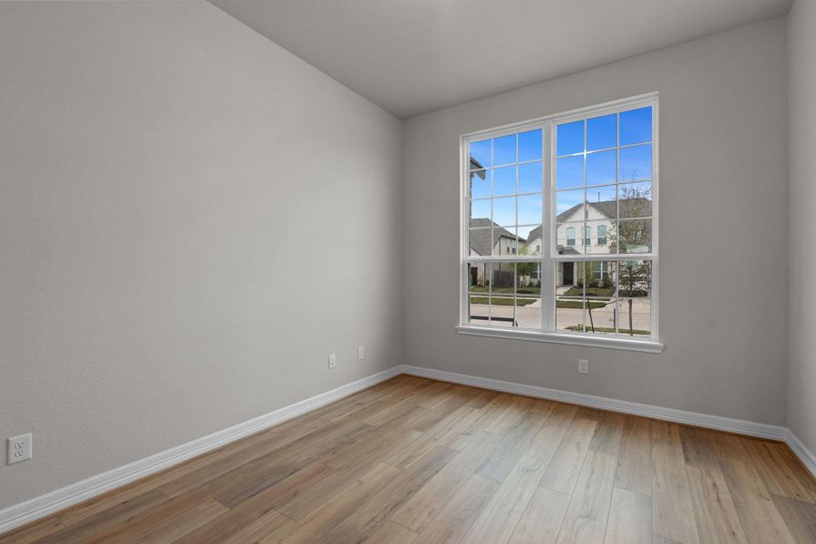 The home office features French doors, beautiful floors, large windows that give a fresh feel, this space promotes focus and creativity.