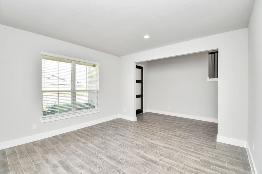 An inviting dining space seamlessly woven into the open concept, connecting the family room and kitchen. Revel in the stunning floors, soothing paint palette, and the crowning touch of a sleek chandelier – a perfect setting for shared meals and cherished moments. An inviting dining space seamlessly woven into the open concept, connecting the family room and kitchen. Revel in the stunning floors, soothing paint palette, and the crowning touch of a sleek chandelier – a perfect setting for shared meals and cherished moments.