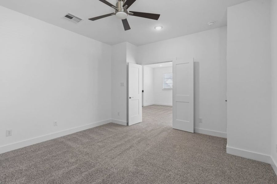 Representative unfurnished interior of a home built from the Waterford by Chesmar Homes in Meridiana 60's, Manvel (Image 35).
