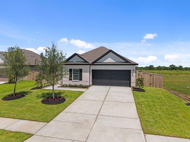Front exterior of a new home in Arabella on the Prairie, Richmond, TX, highlighting curb appeal (Image 20). Front exterior of a new home in Arabella on the Prairie, Richmond, TX, highlighting curb appeal (Image 20).