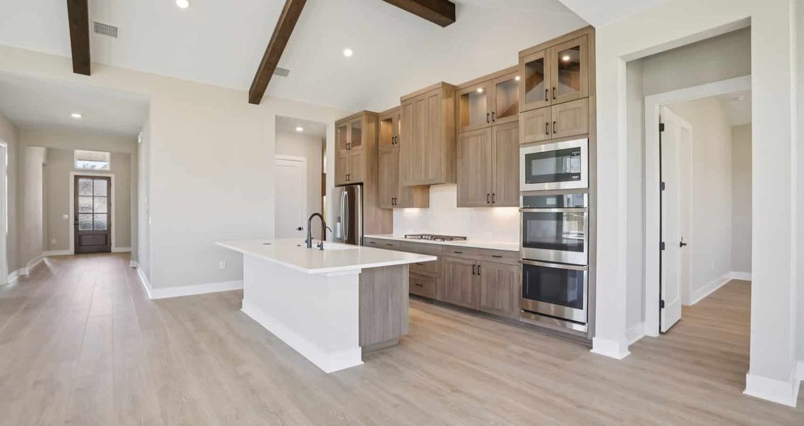 Furnished interior view inside a new home in 6 Creeks, Kyle (Image 6).