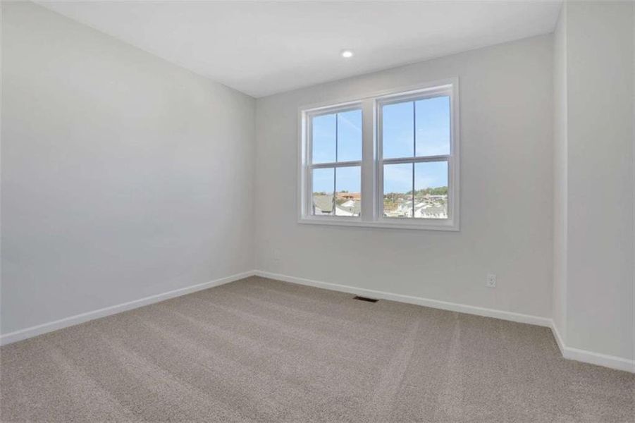 Spacious, unfurnished interior of a new home in The Paddocks at Doc Hughes, Buford (Image 44).
