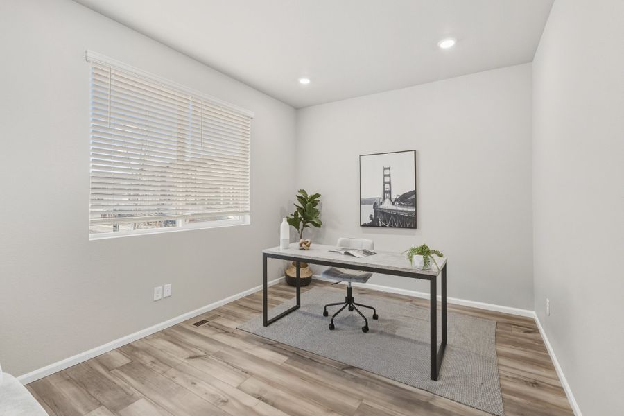 Furnished interior view inside a new home in Woodrose at Painted Prairie, Aurora (Image 9).