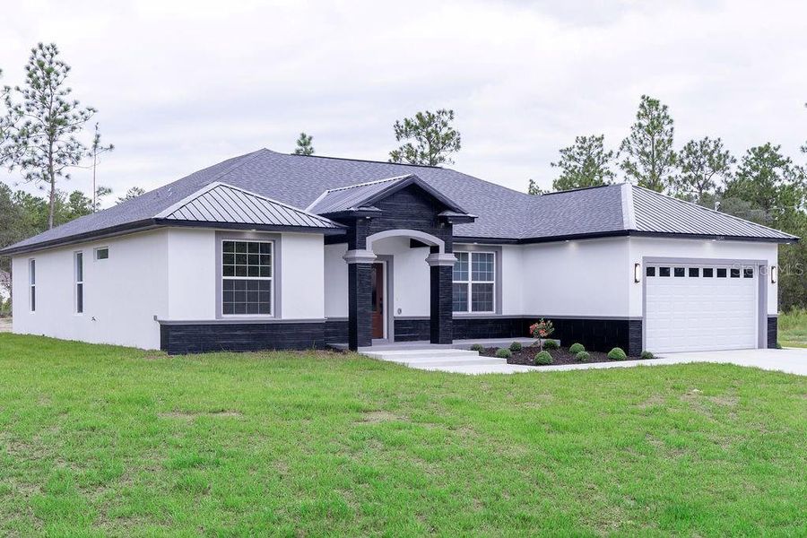 Front exterior of a new home in , Dunnellon, FL, highlighting curb appeal (Image 25). Front exterior of a new home in , Dunnellon, FL, highlighting curb appeal (Image 25).