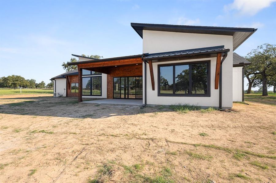 Back of property featuring a patio area