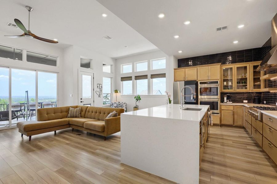 There's a gas cooktop, dual ovens, dishwasher, and an under-counter microwave for "out of sight" convenience.