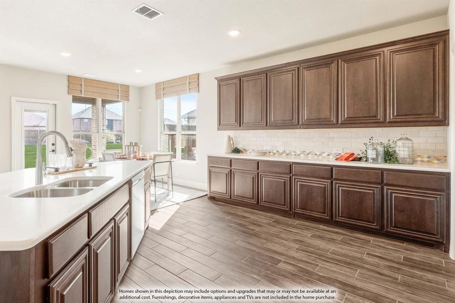 Kitchen with dark wood cabinets, white countertops, subway tile backsplash, and wood-look tile floors Kitchen with dark wood cabinets, white countertops, subway tile backsplash, and wood-look tile floors