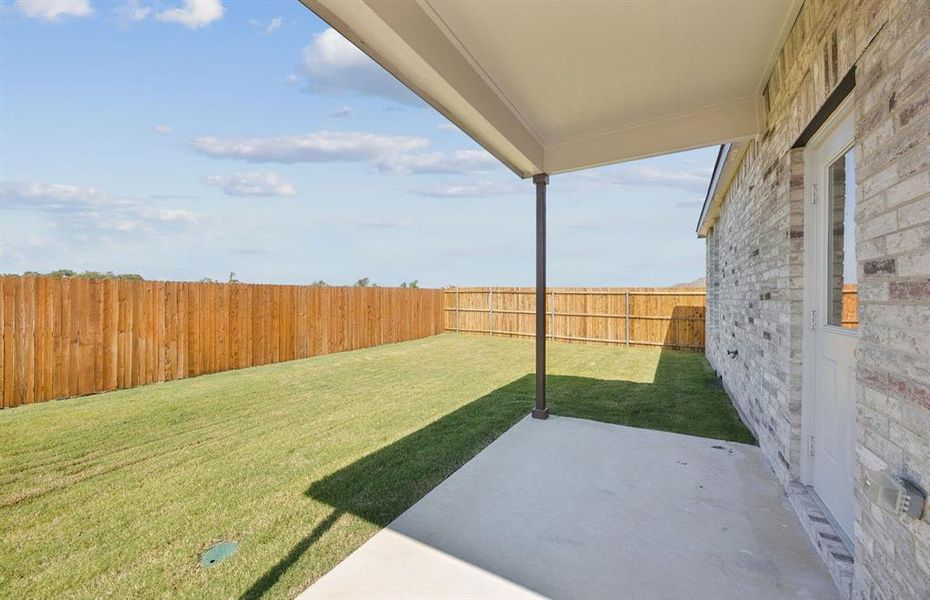 Fenced in backyard with covered patio Fenced in backyard with covered patio