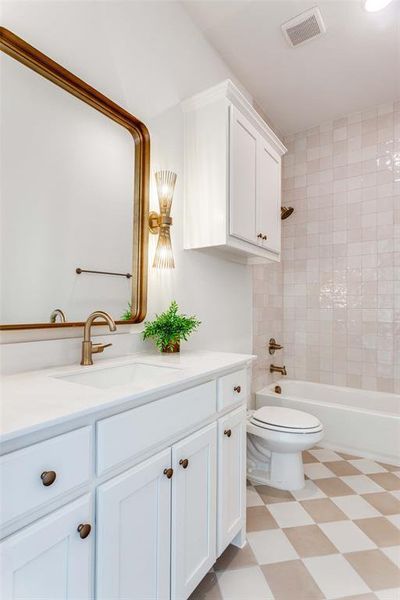 Full bathroom featuring vanity, shower / bath combination, and light flooring Full bathroom featuring vanity, shower / bath combination, and light flooring