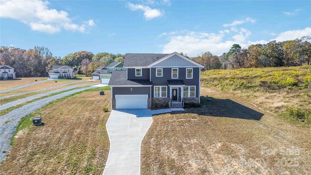 Front exterior of a new home in , Monroe, NC, highlighting curb appeal (Image 2).