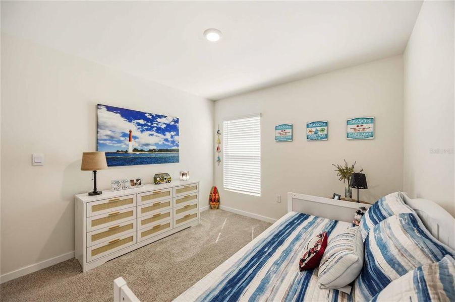 Furnished interior view inside a new home in Central Parc, North Port (Image 40).