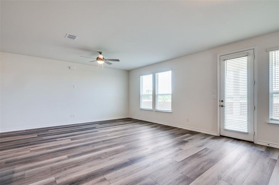 Empty room featuring ceiling fan and wood finished floors Empty room featuring ceiling fan and wood finished floors