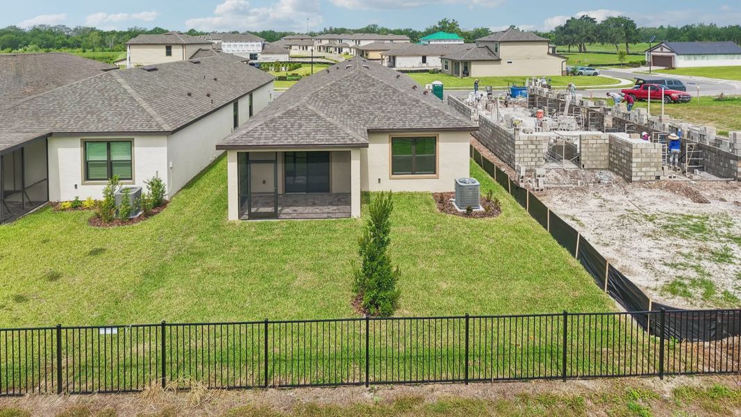 Exterior details and patio area of a home in Grasslands West, Lakeland (Image 24).