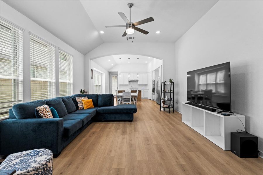 Spacious, open-plan living area with a vaulted ceiling and modern design. Spacious, open-plan living area with a vaulted ceiling and modern design.