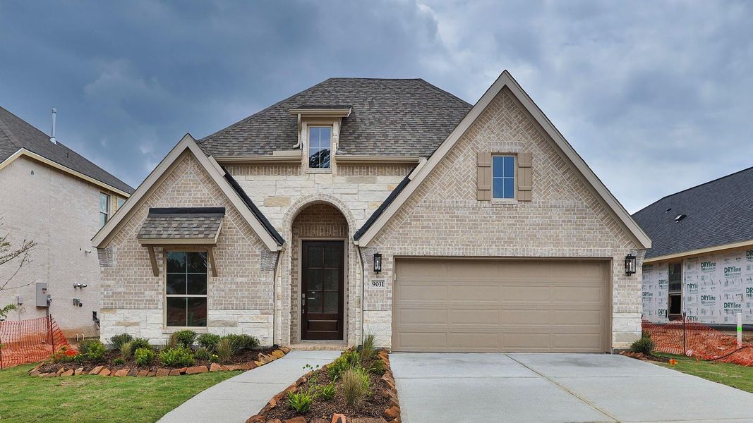 Front exterior of a new home in Two Step Farm, Montgomery, TX, highlighting curb appeal (Image 2). Front exterior of a new home in Two Step Farm, Montgomery, TX, highlighting curb appeal (Image 2).