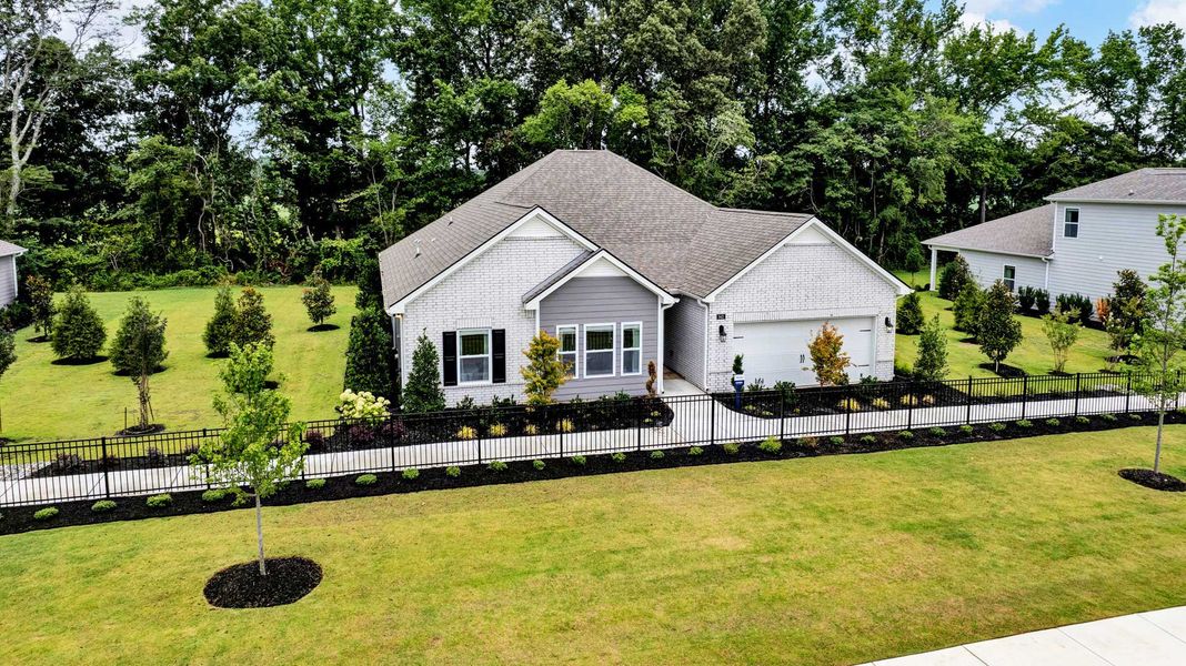 Representative exterior photo of a completed home built from the Cairn by D.R. Horton in Riverwood Gardens, Oakland, TN (Image 21). Representative exterior photo of a completed home built from the Cairn by D.R. Horton in Riverwood Gardens, Oakland, TN (Image 21).