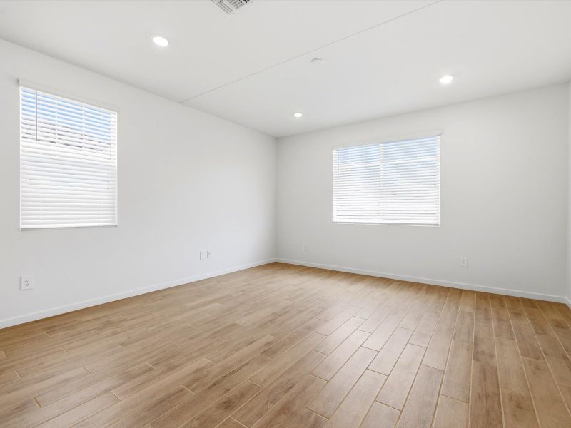 Spacious, unfurnished interior of a new home in Blossom Rock Reserve Series, Apache Junction (Image 12).