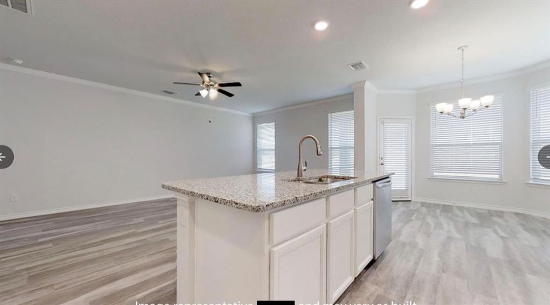 Kitchen featuring a sink, light wood-type flooring, stainless steel dishwasher, a ceiling fan, and crown molding