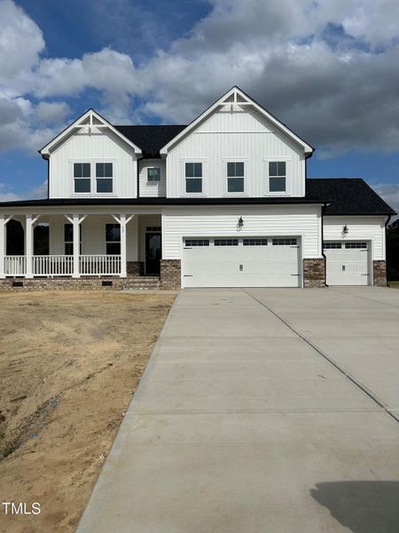 Front exterior of a new home in Tobacco Road, Angier, NC, highlighting curb appeal (Image 81). Front exterior of a new home in Tobacco Road, Angier, NC, highlighting curb appeal (Image 81).