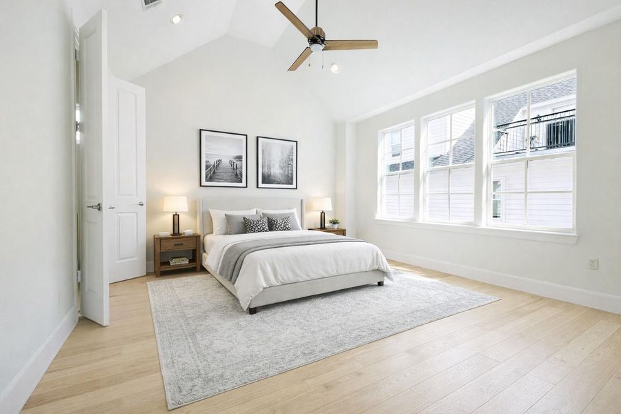 Vaulted ceilings and yet more light pours into the primary bedroom!
