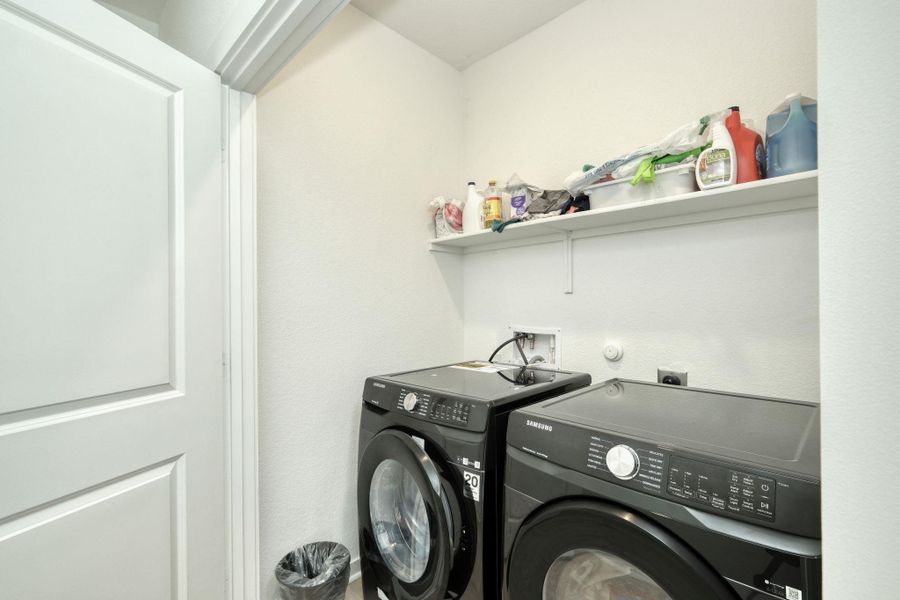 Laundry room with washer and dryer and laundry area