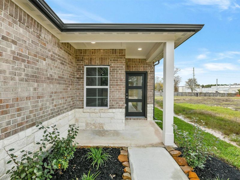 Exterior details and patio area of a home in Windmill Estates, Magnolia (Image 3).